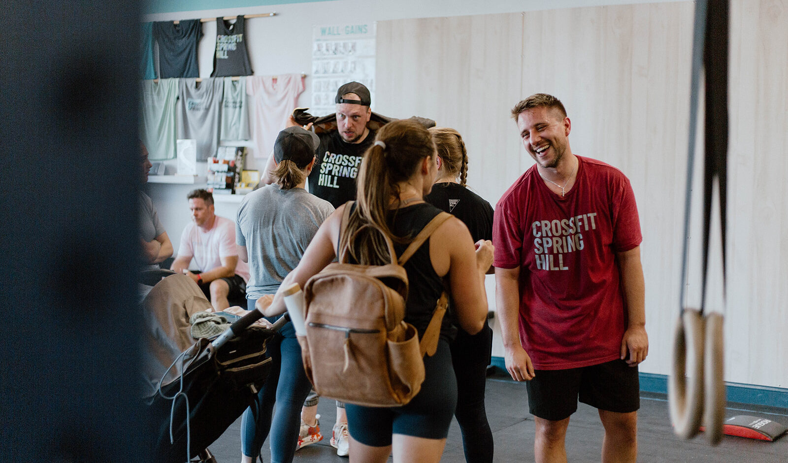 CrossFit Spring Hill members, every day busy adults, welcome one another in between classes.