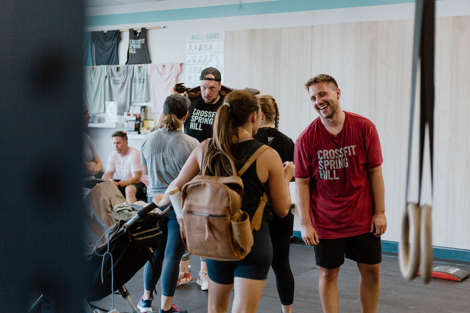CrossFit Spring Hill members, every day busy adults, welcome one another in between classes.
